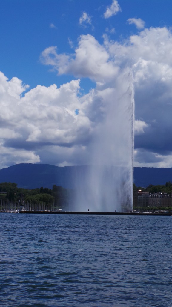 The Geneva Water Fountain / Jet d'Eau (you can see tiny dots nearby, those are people!)